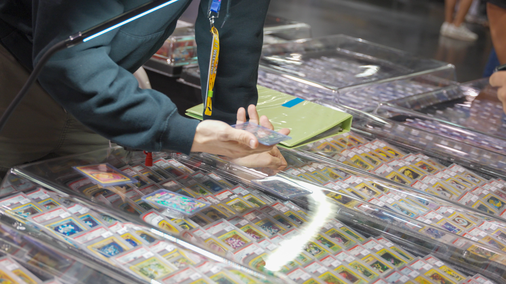 Browsing trading cards at a vendor table