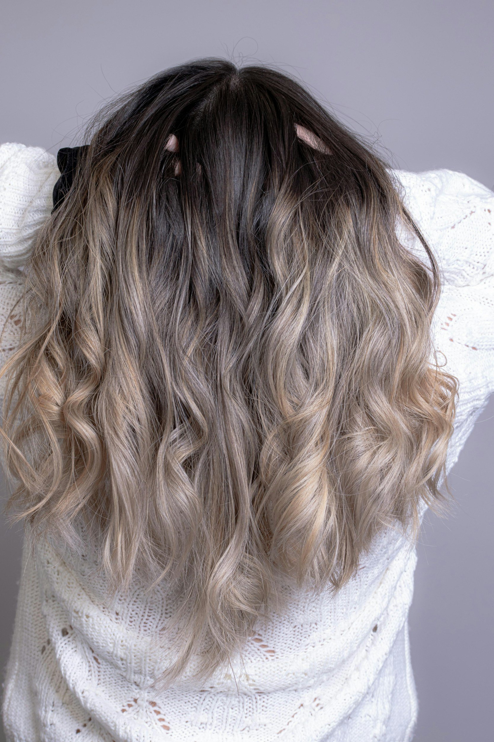 Long curly dark hair with highlights