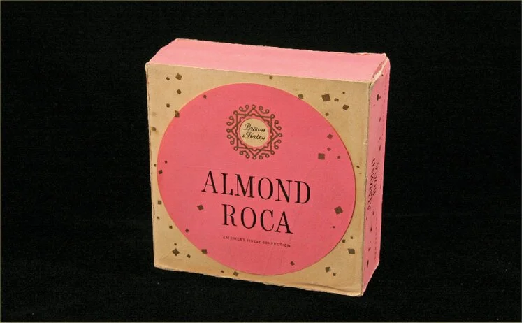 Almond Roca is packaged in the now famous pink tin.