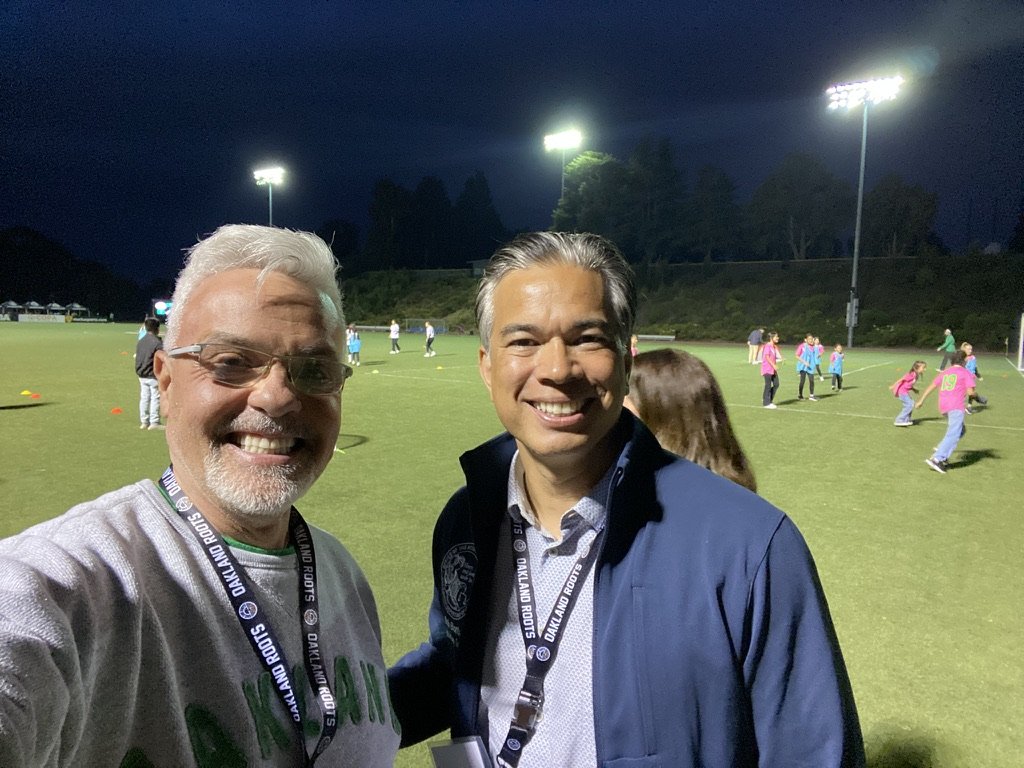  Michael Colbruno with California Attorney General Rob Bonta at an Oakland Roots soccer game. 
