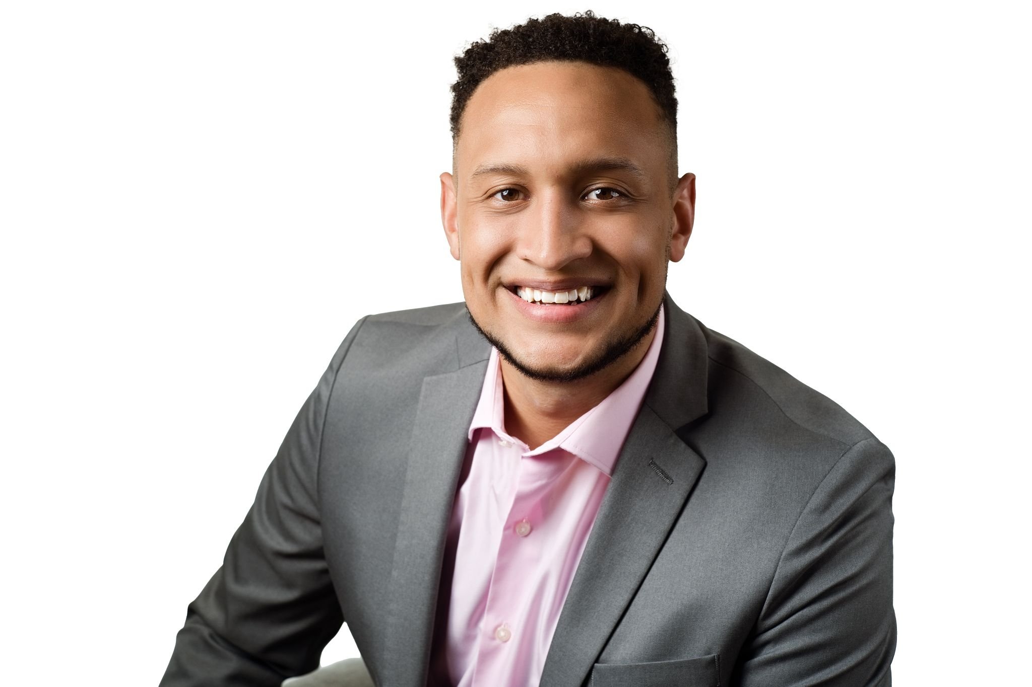 Professional studio headshot of a businessman projecting confidence and approachability.