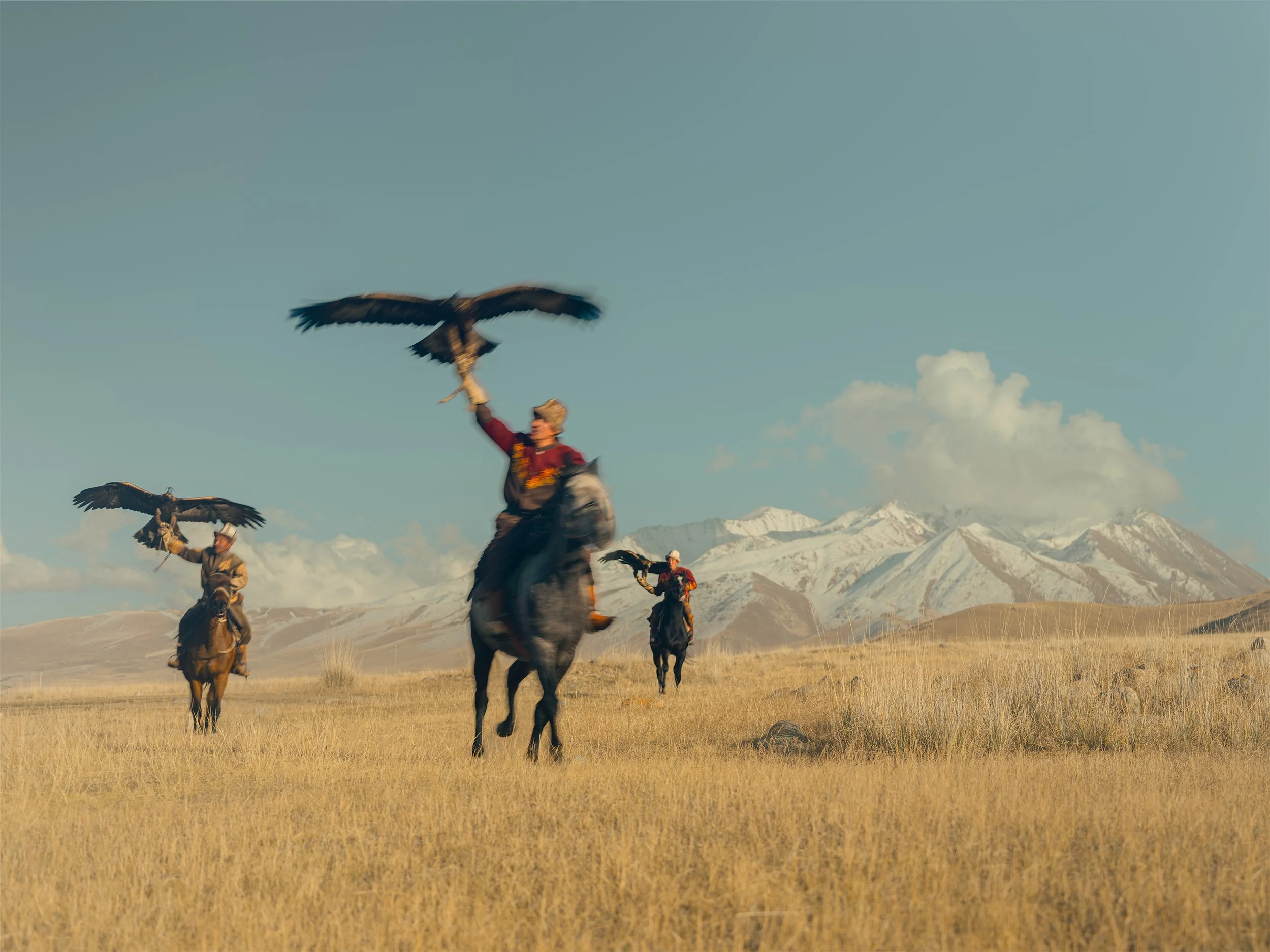 AdamDockerPhotography_EagleHunters_Kyrgystan_GoldenEagle_ThreeRiders.jpg