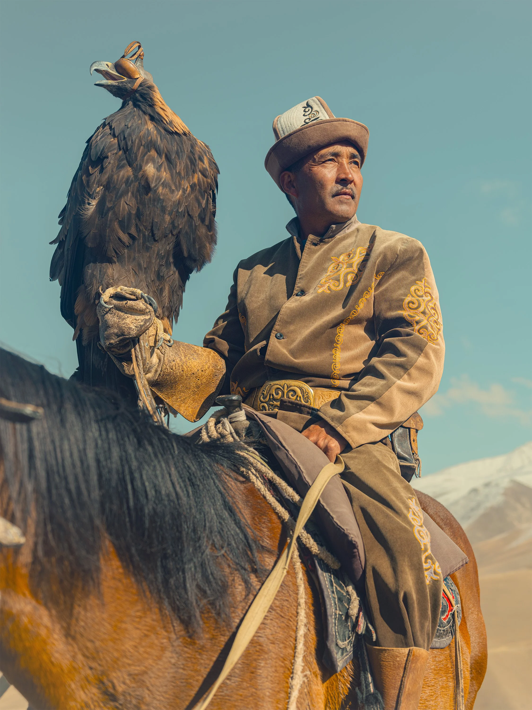 AdamDockerPhotography_EagleHunters_Kyrgystan_GoldenEagle_Horse_HeroicPortrait.jpg