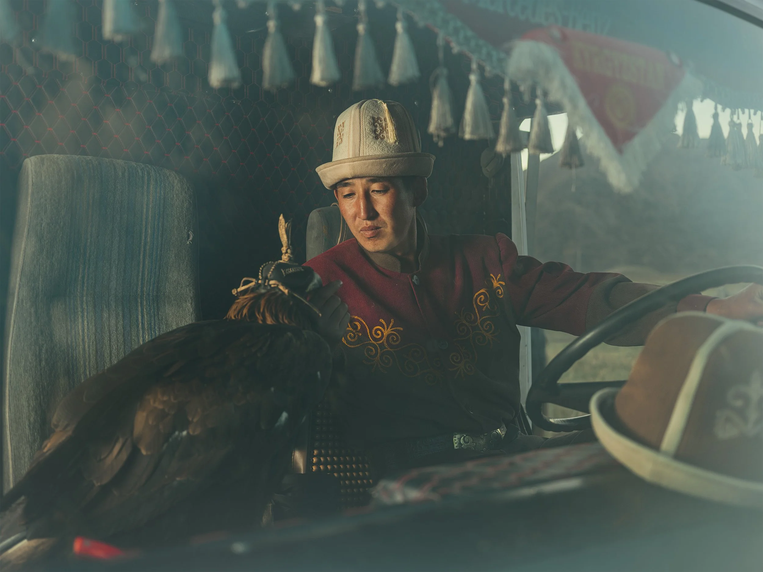EagleHunters_Kyrgystan_GoldenEagle_InsideVan_Portrait.jpg