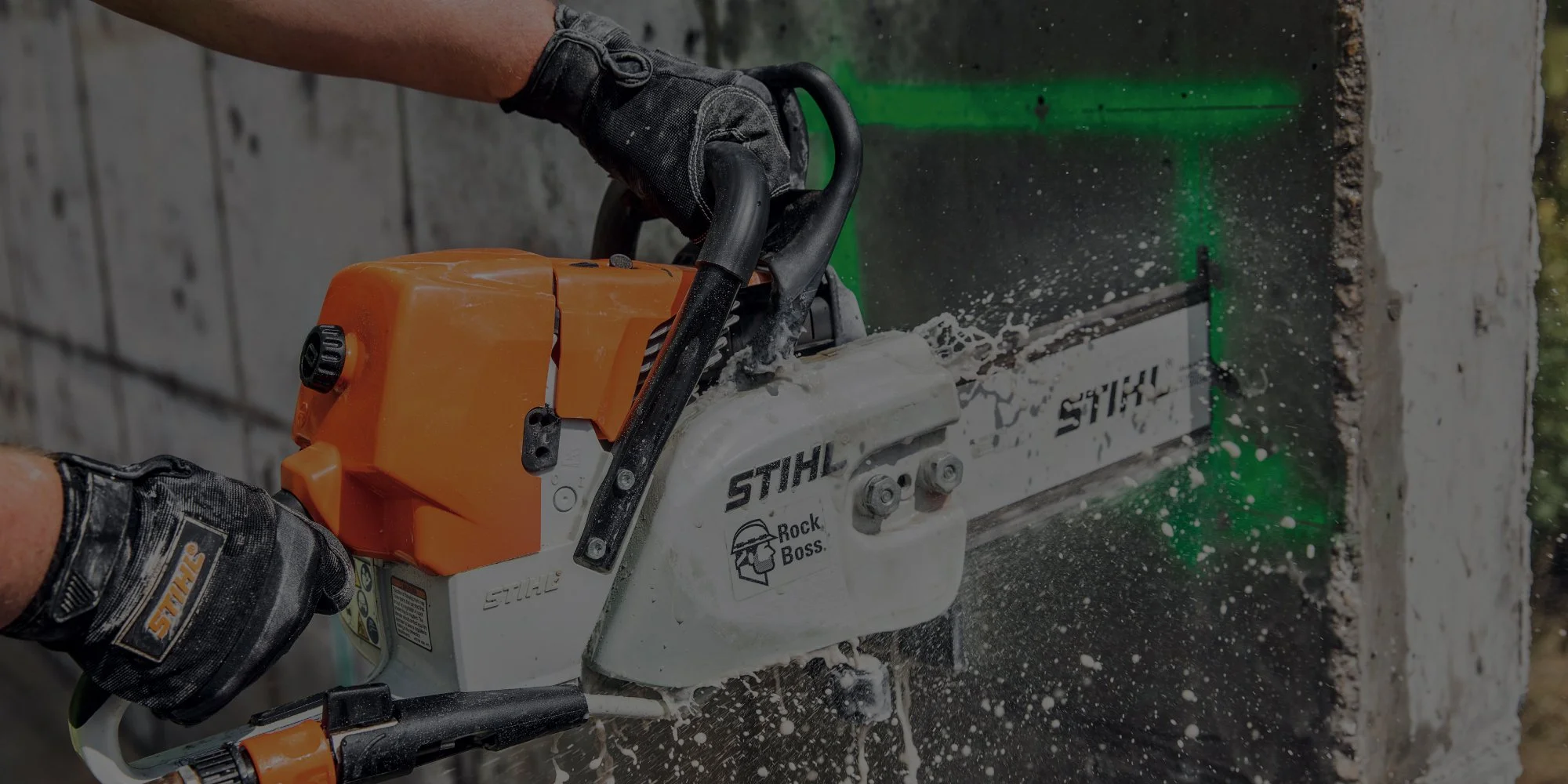 Contractor cutting a block wall with a STIHL cut-off saw