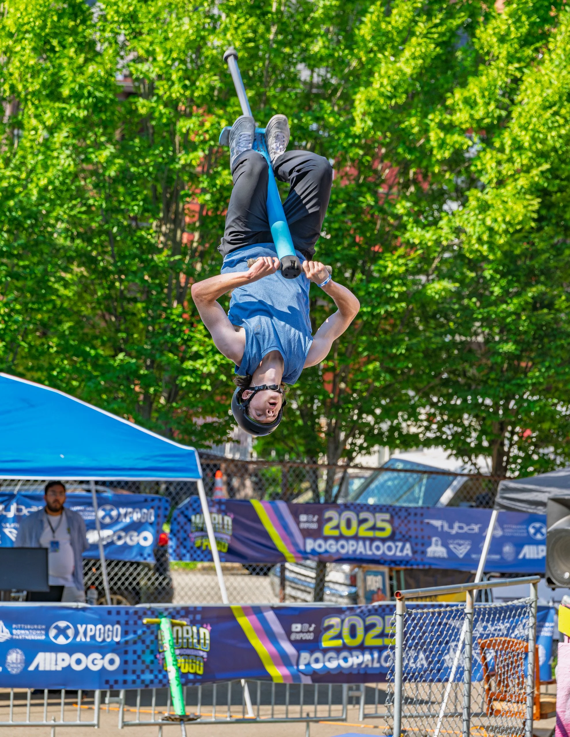 Xpogo Stunt Team performing a pogo stick backflip in front of a baseball crowd — available for booking in Nashville, TN