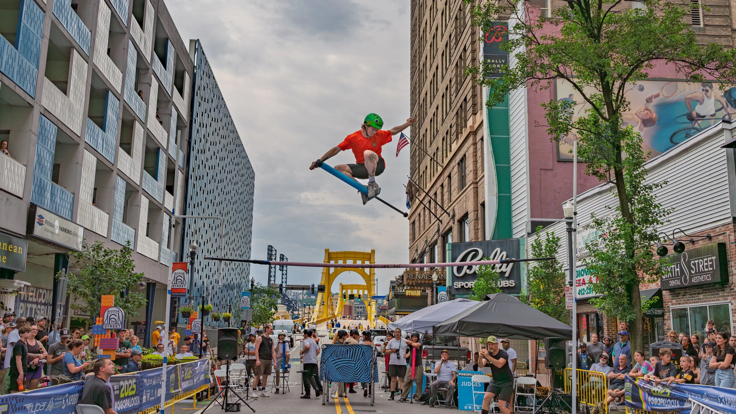 Xpogo Stunt Team performing a pogo stick backflip in front of a baseball crowd — available for booking in Nashville, TN