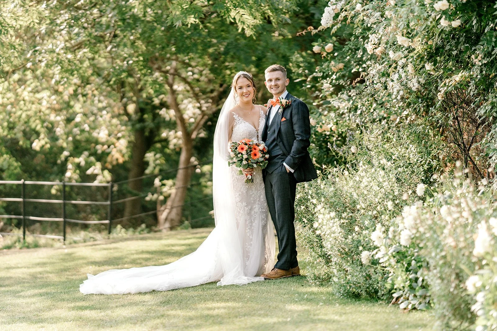 bride and groom portraits in the sun at apton hall in essex captured by laura jane photography