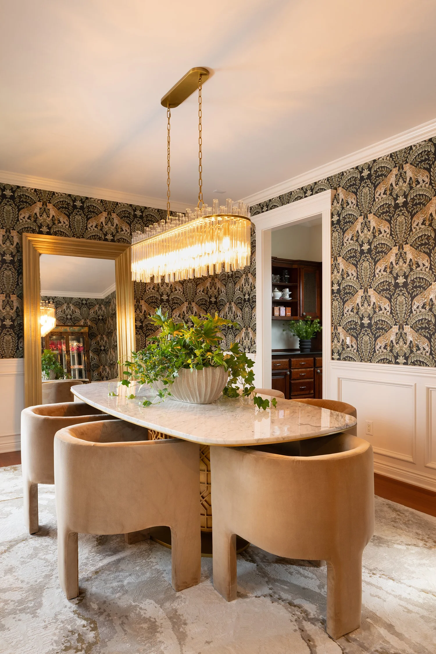 Elegant Obelisk Home interior with layered furnishings and statement lighting