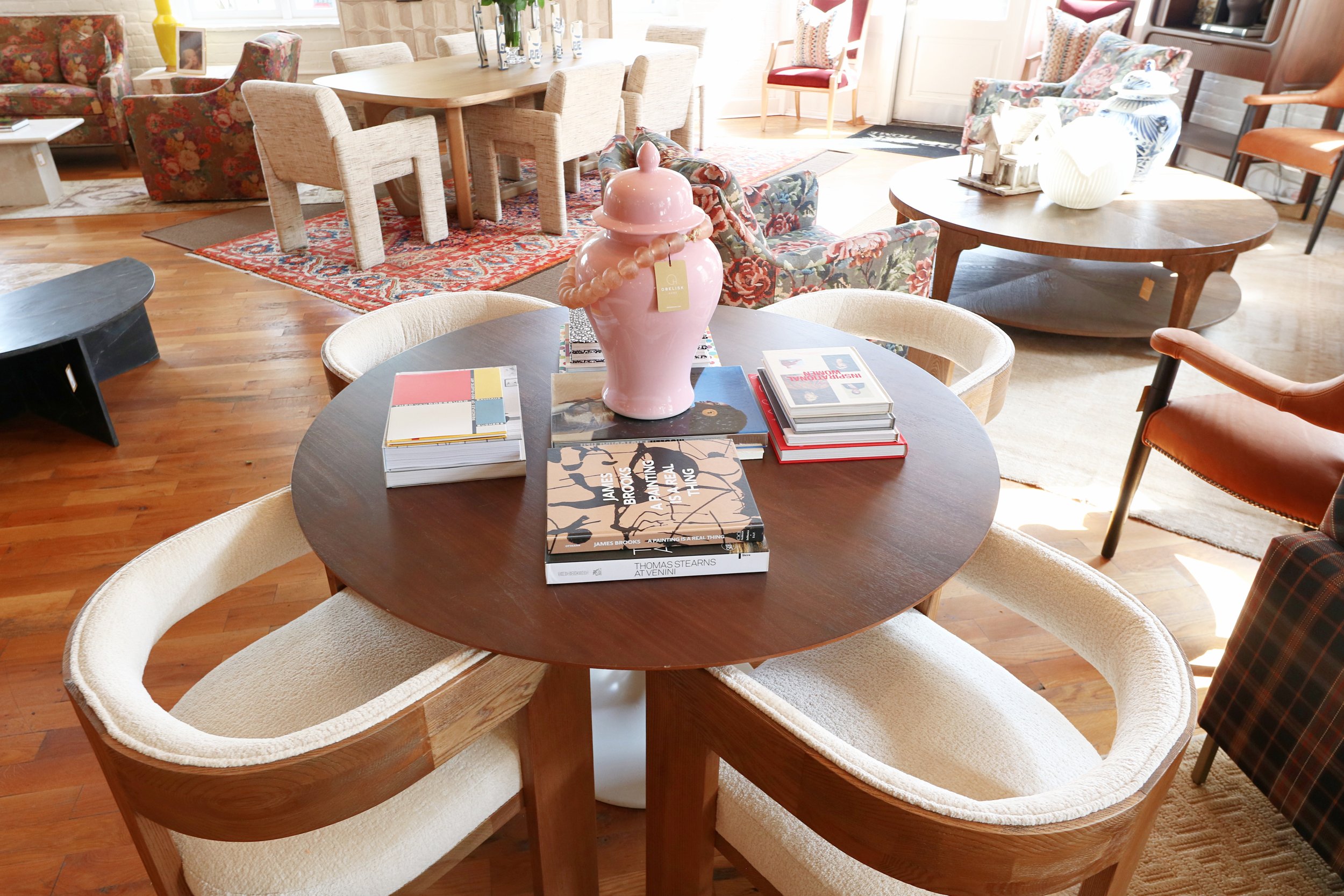 Obelisk Home store showing tables, chairs, books and vases..jpg
