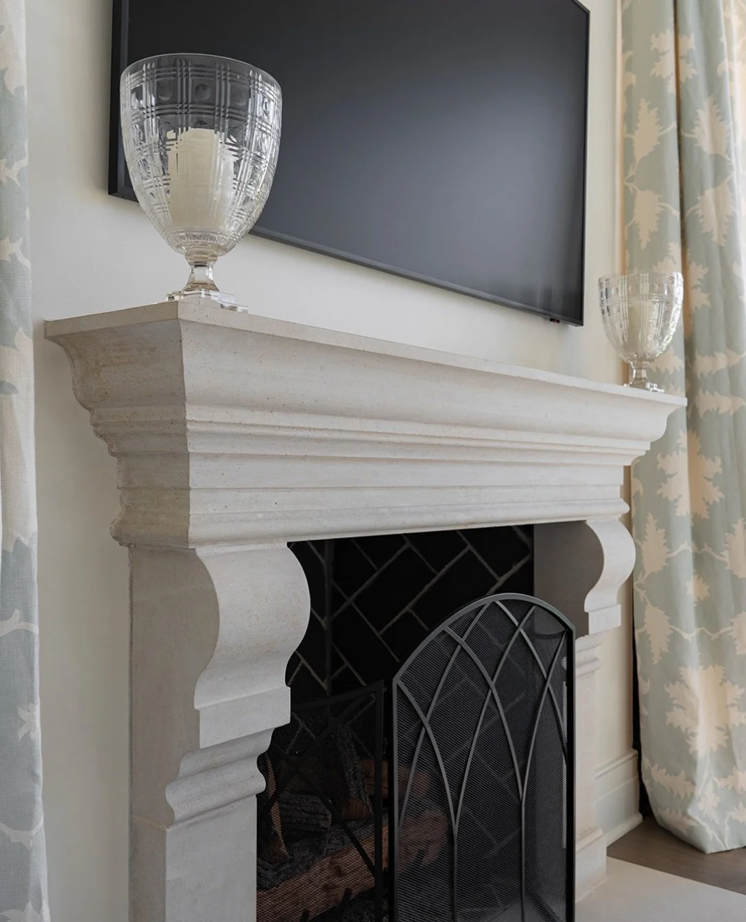 This primary bedroom fireplace surround creates the perfect focal point &mdash; featuring meticulously carved, soft curves for a timeless and sophisticated look.

/ Birchwood Smooth Cut Stone Fireplace Surround

Architect: Jim Bulejski
Builder: @free