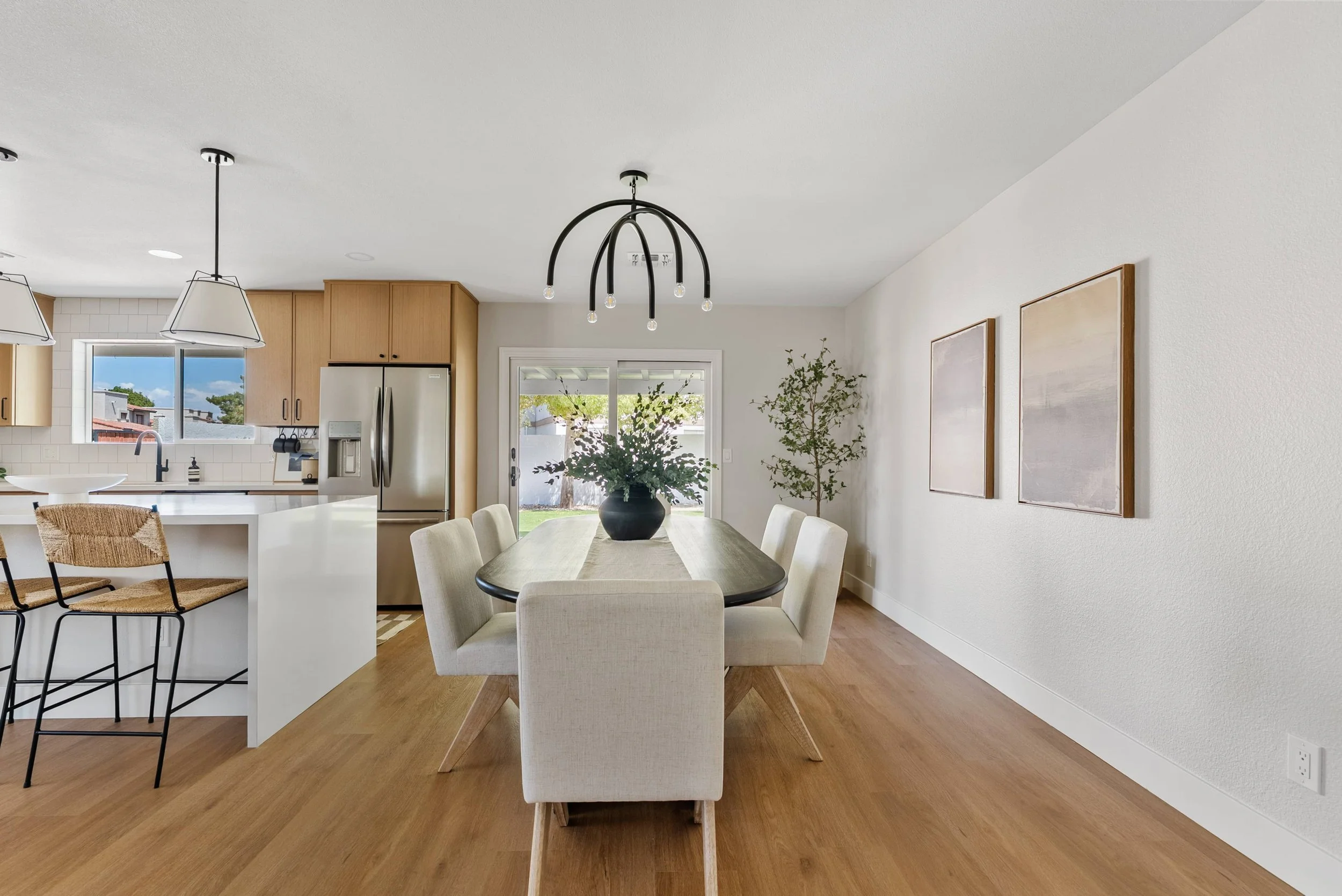 An open concept dining room and kitchen in a residential home.