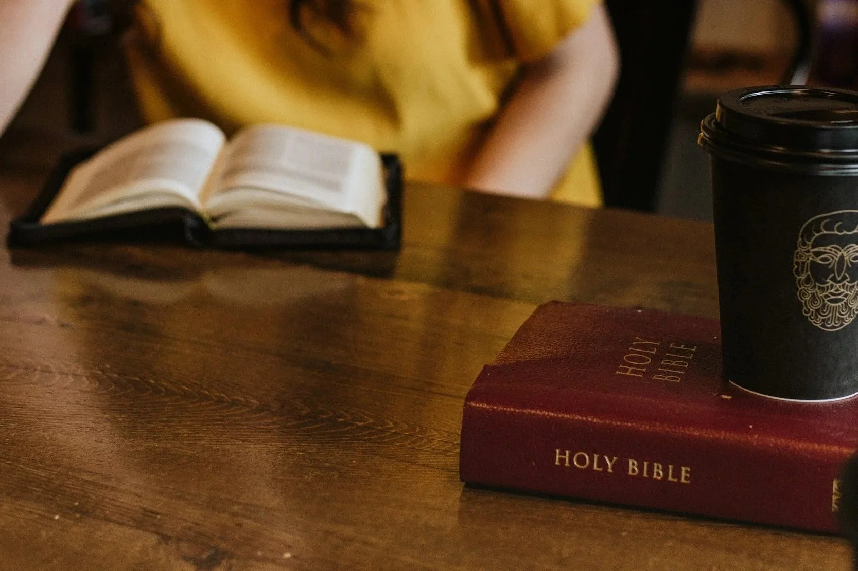 Sitting in coffee shop discussing Jesus and Bible