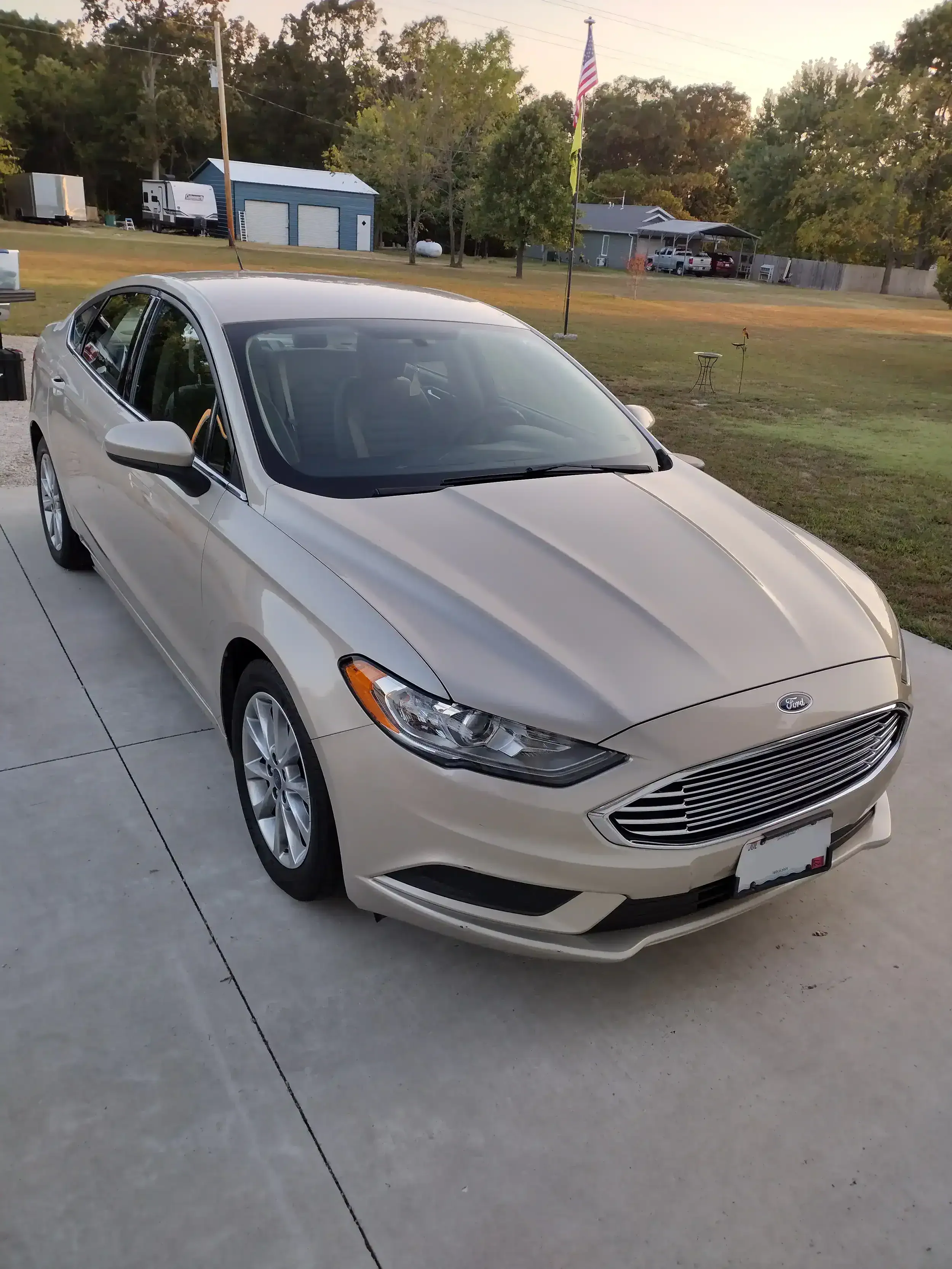 Exterior car detailing results in Willard, MO — freshly cleaned sedan with a high-gloss finish
