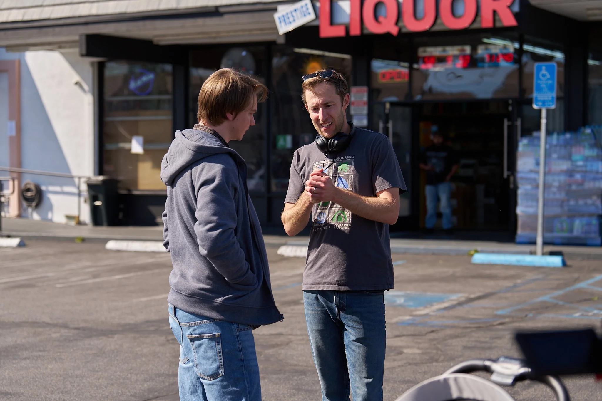 Unit stills photography, for the short film TEDDY, BTS image of director Jonathan Siebel and actor Calum Worthy on set.