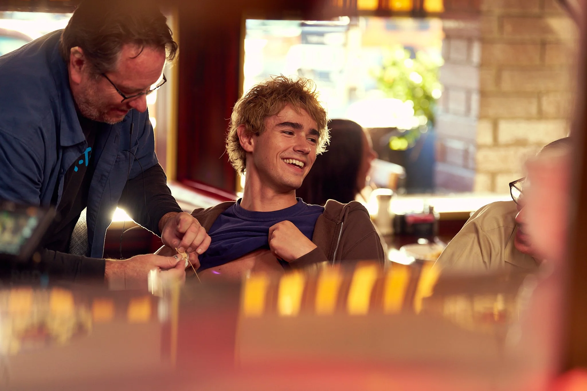 On-set unit stills photography, The Making of Jesus Diabetes, actor Charlie Besso getting mic'd up.
