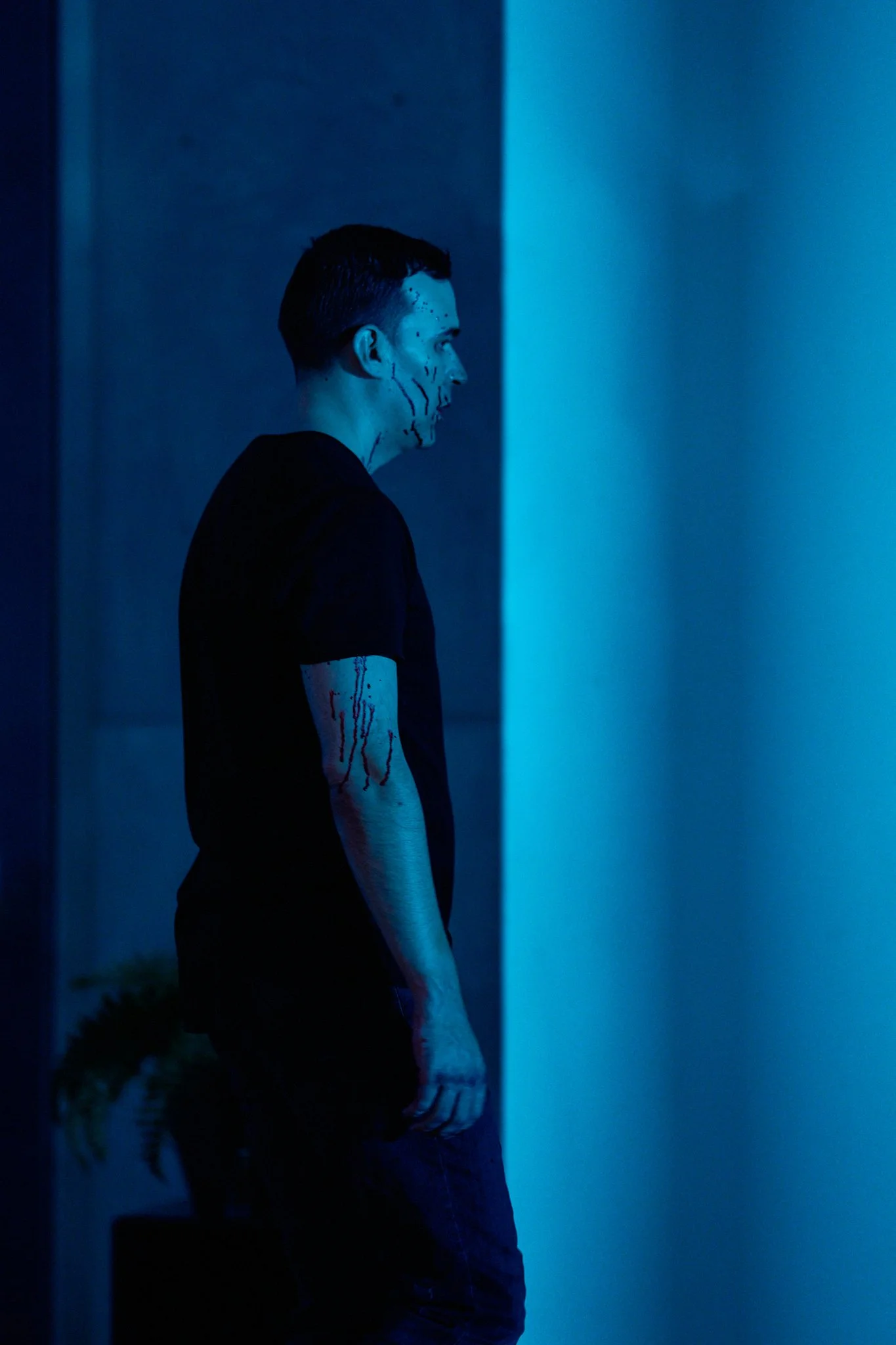 Unit stills photography, for the short film Doppelgänger, actor Mark Haan stalks through the house in a scene.