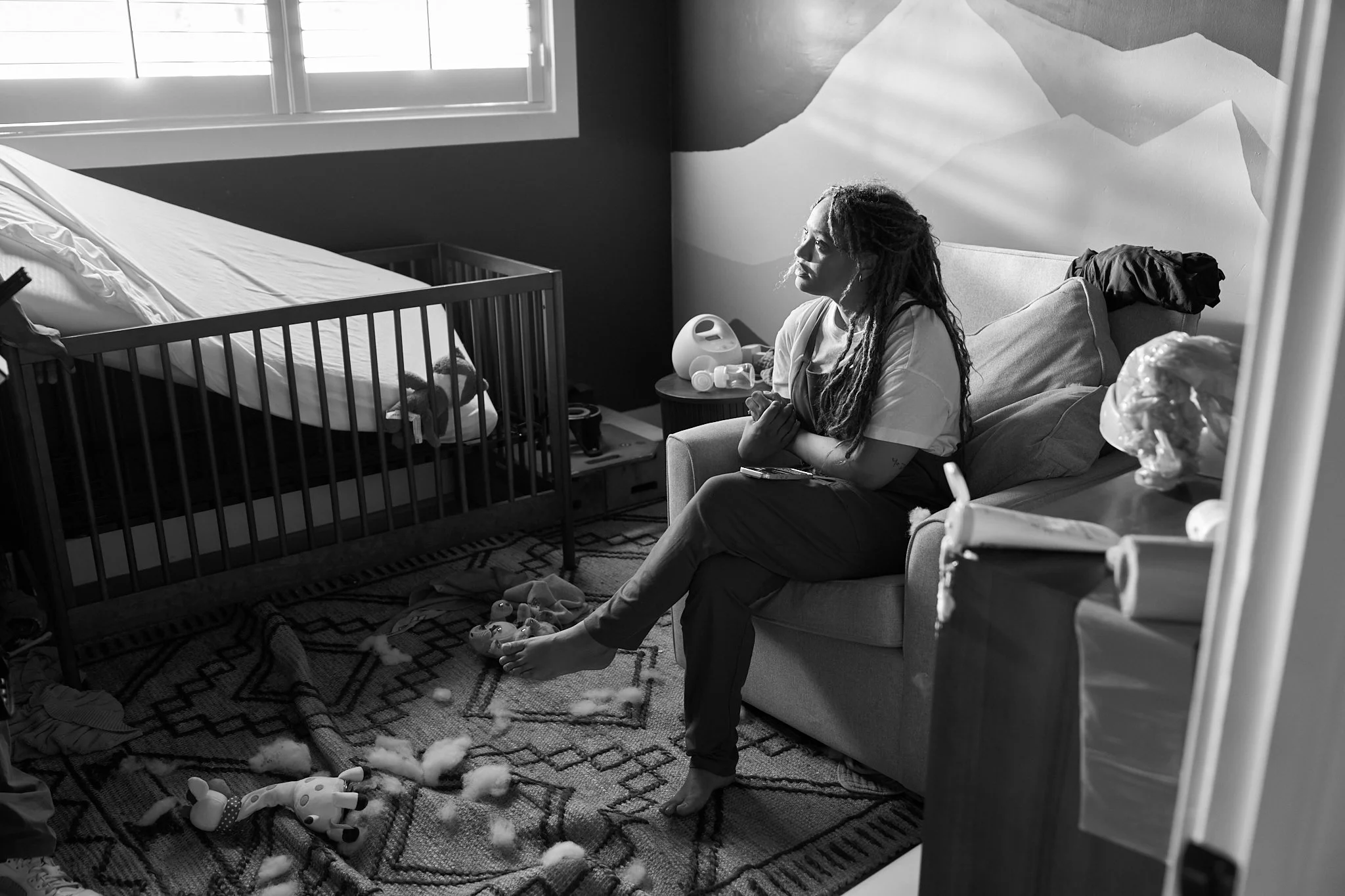 Unit stills photography, for the short film TEDDY, BTS image of actor Kiersey Clemmons sitting on set.