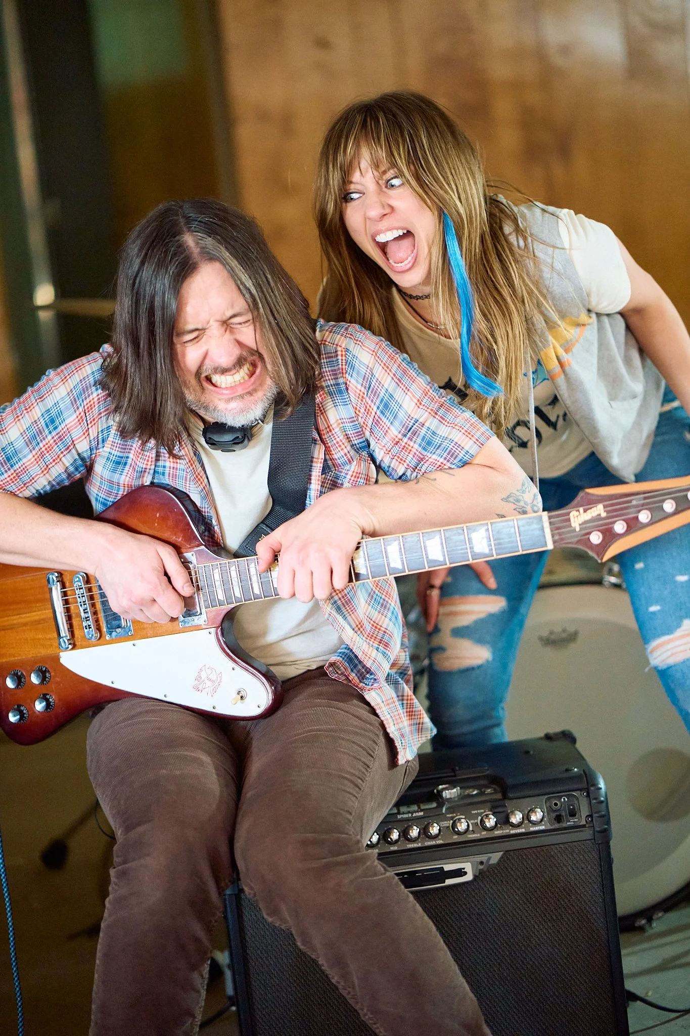 Unit stills photography, Super Fan vertical film, featuring The All-American Rejects. Actor Anna Lore and guitarist Nick Wheeler in the garage scene.