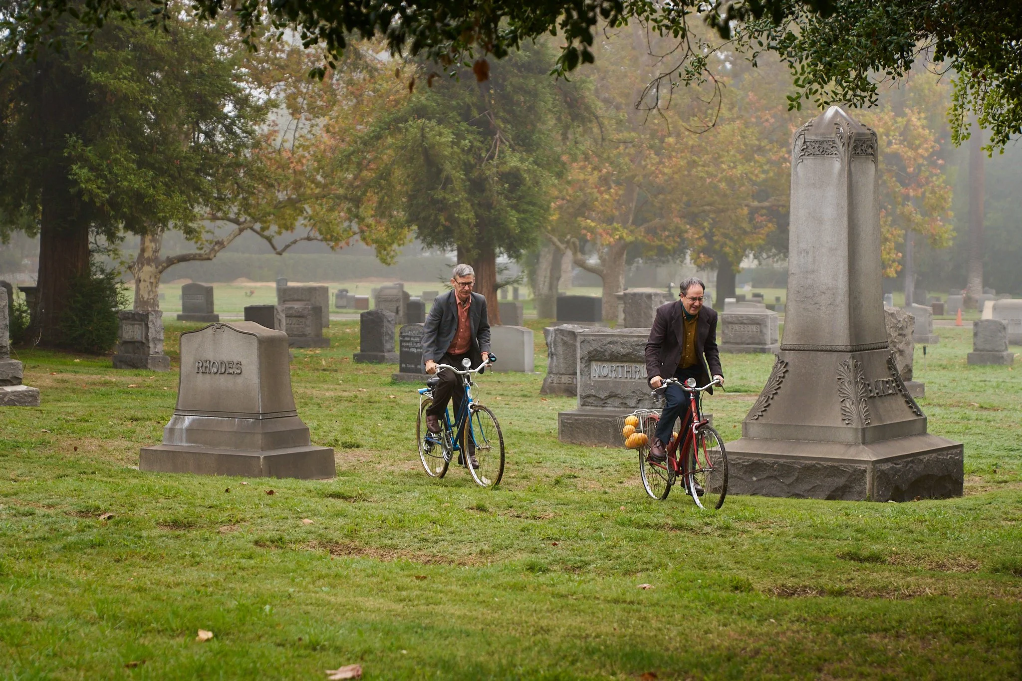 On-set unit stills photography, The Making of Jesus Diabetes, actors Michael Naughton and Andrew Friedman  in a scene riding their bikes through the cemetery.