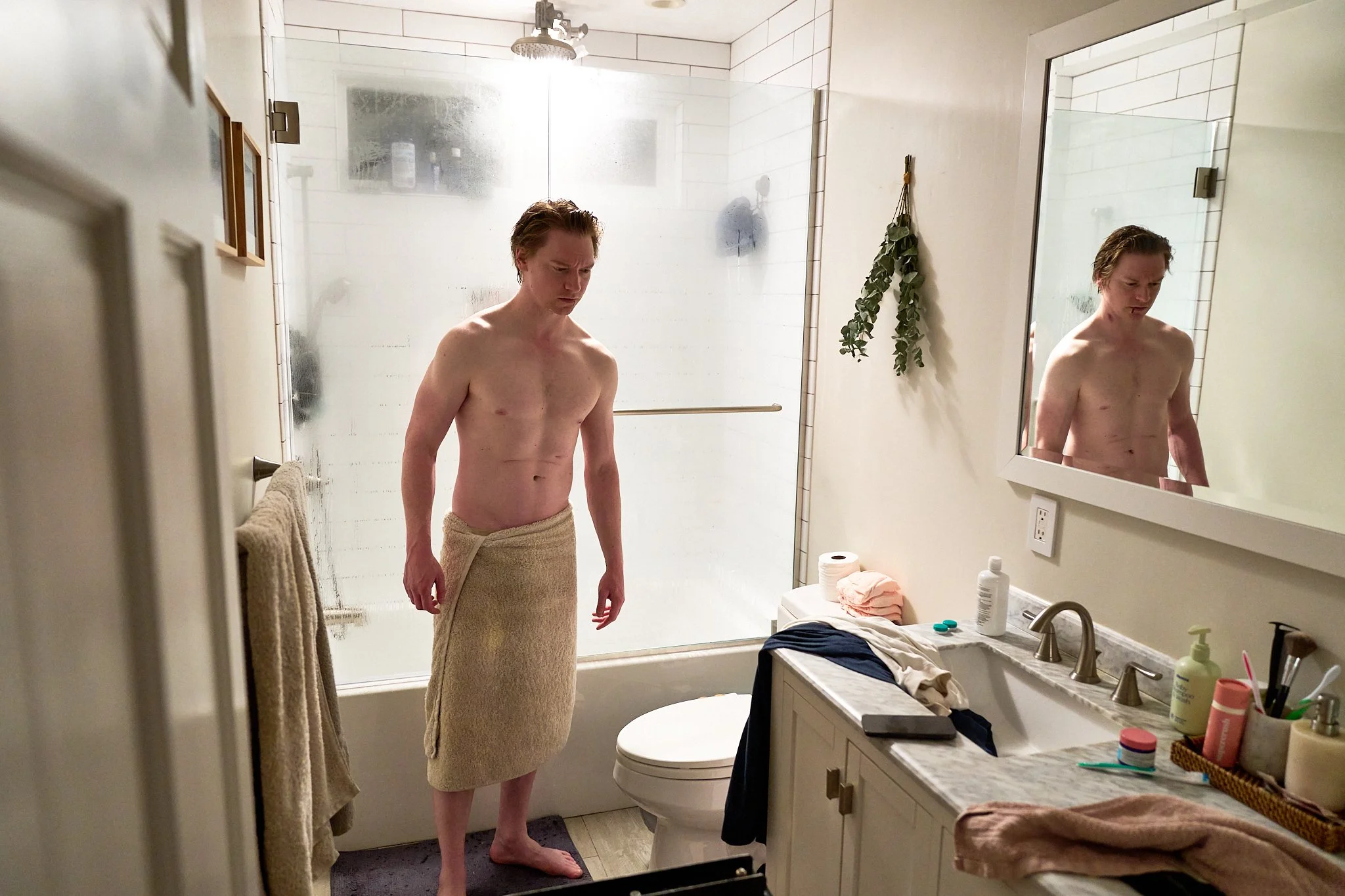 Unit stills photography, for the short film TEDDY, BTS image of actor Calum Worthy in the bathroom scene.