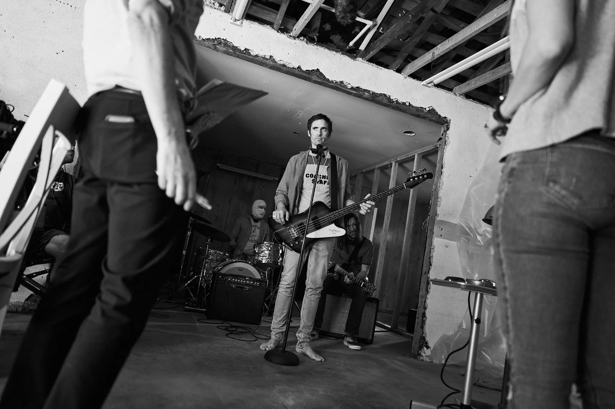 Unit stills photography, Super Fan vertical film, featuring The All-American Rejects. Behind the scenes of the All-American Rejects in a scene where they're forced to perform in a garage.