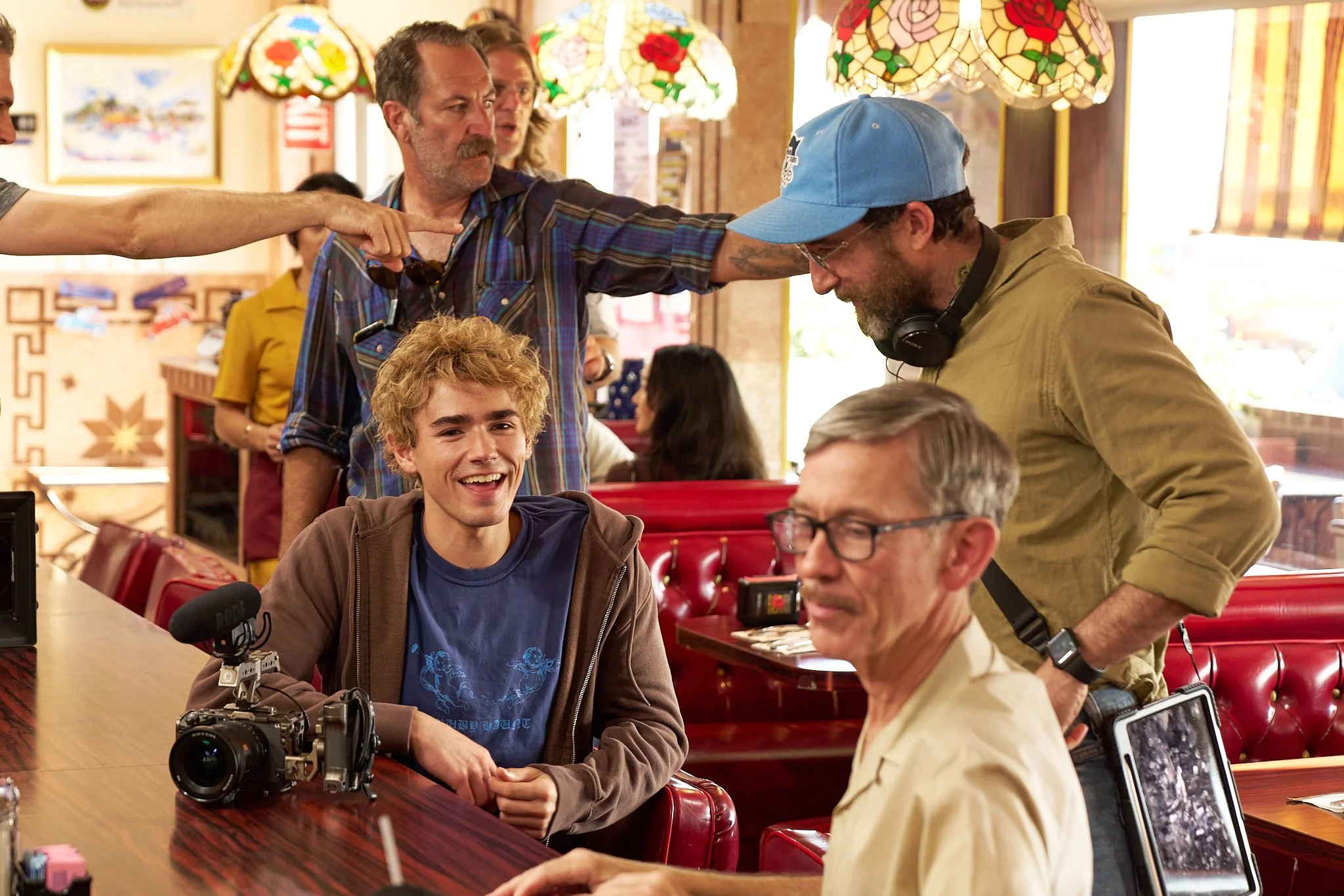 On-set unit stills photography, The Making of Jesus Diabetes, actors and crew in between takes.