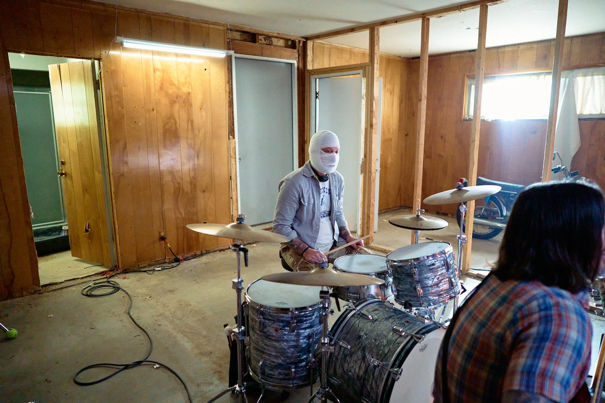Unit stills photography, Super Fan vertical film, featuring The All-American Rejects. Drummer Chris Gaylor in the garage scene.
