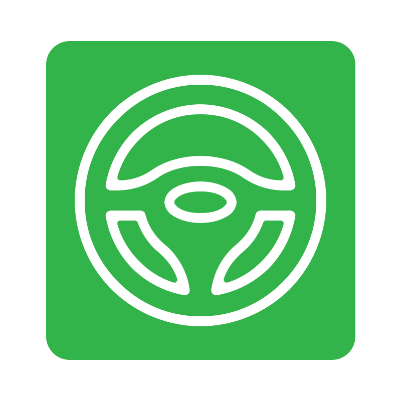 Green road sign with white steering wheel icon indicating a lane or driving direction