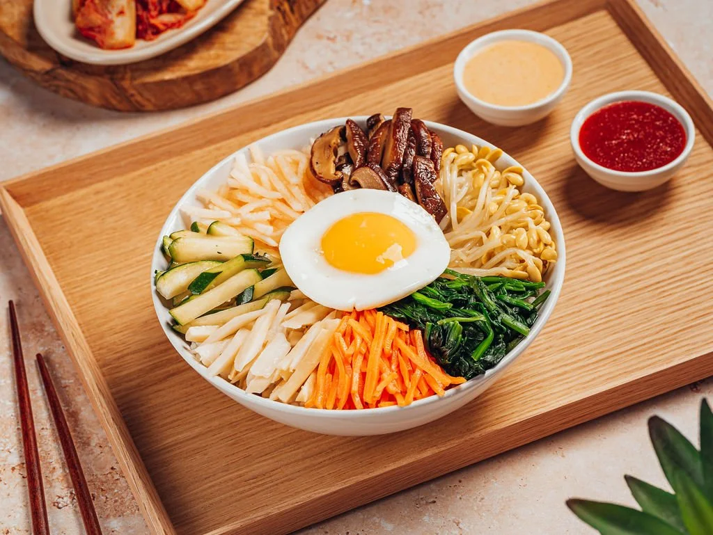 Doraji bibimbap with seasoned vegetables and a fried egg