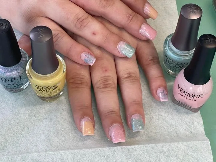 Acrylic nails over nail polish bottles