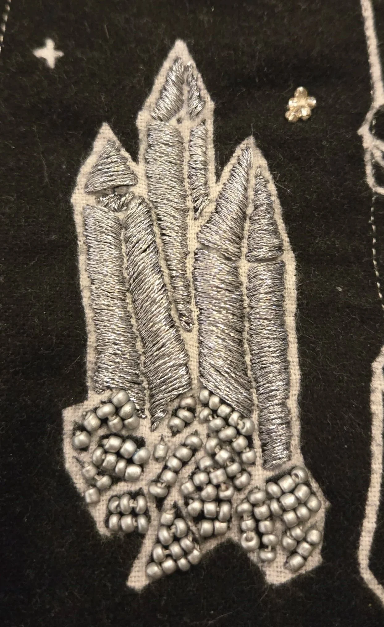 Beading and embroidering the clusters