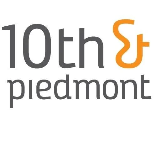 Logo for 10th & Piedmont with the text '10th & Piedmont' and an orange ampersand
