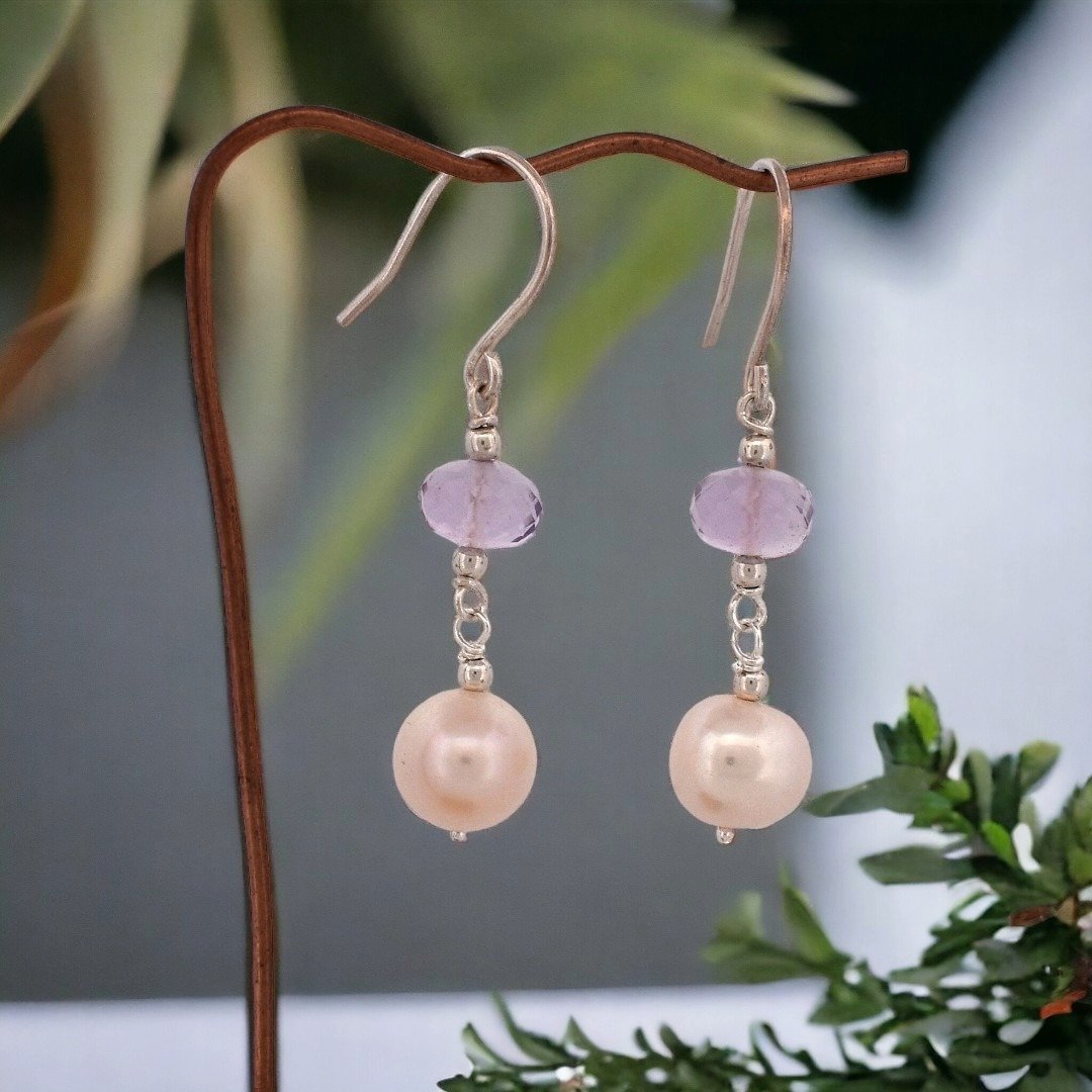 These amethyst and freshwater pearl earrings will turn heads!  Available now.  They come with rubber ear backs for a secure fit! The metal components are all sterling silver.

DM for enquiries.  This would make a classy gift for mother's day!

#mothe