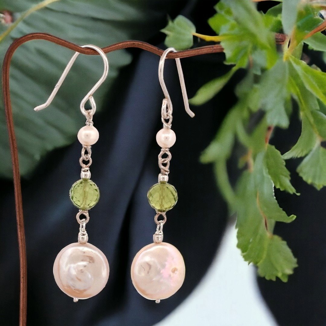 Capture the elegance of nature with our latest creation - these charming earrings, delicately handcrafted for the nature-inspired soul. A harmonious blend of lustrous pearls and vivid green gems, each pair tells a story of serenity and timeless beaut