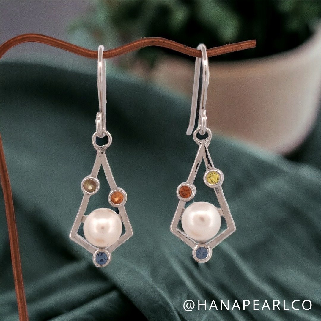 🌟 Just Launched! Dive into elegance with our newly designed Multi-Gem &amp; Freshwater Pearl Earrings, a symphony of craftsmanship in sterling silver. ✨

💎 Each piece is adorned with a unique constellation of vibrant gems and lustrous pearls, ensur