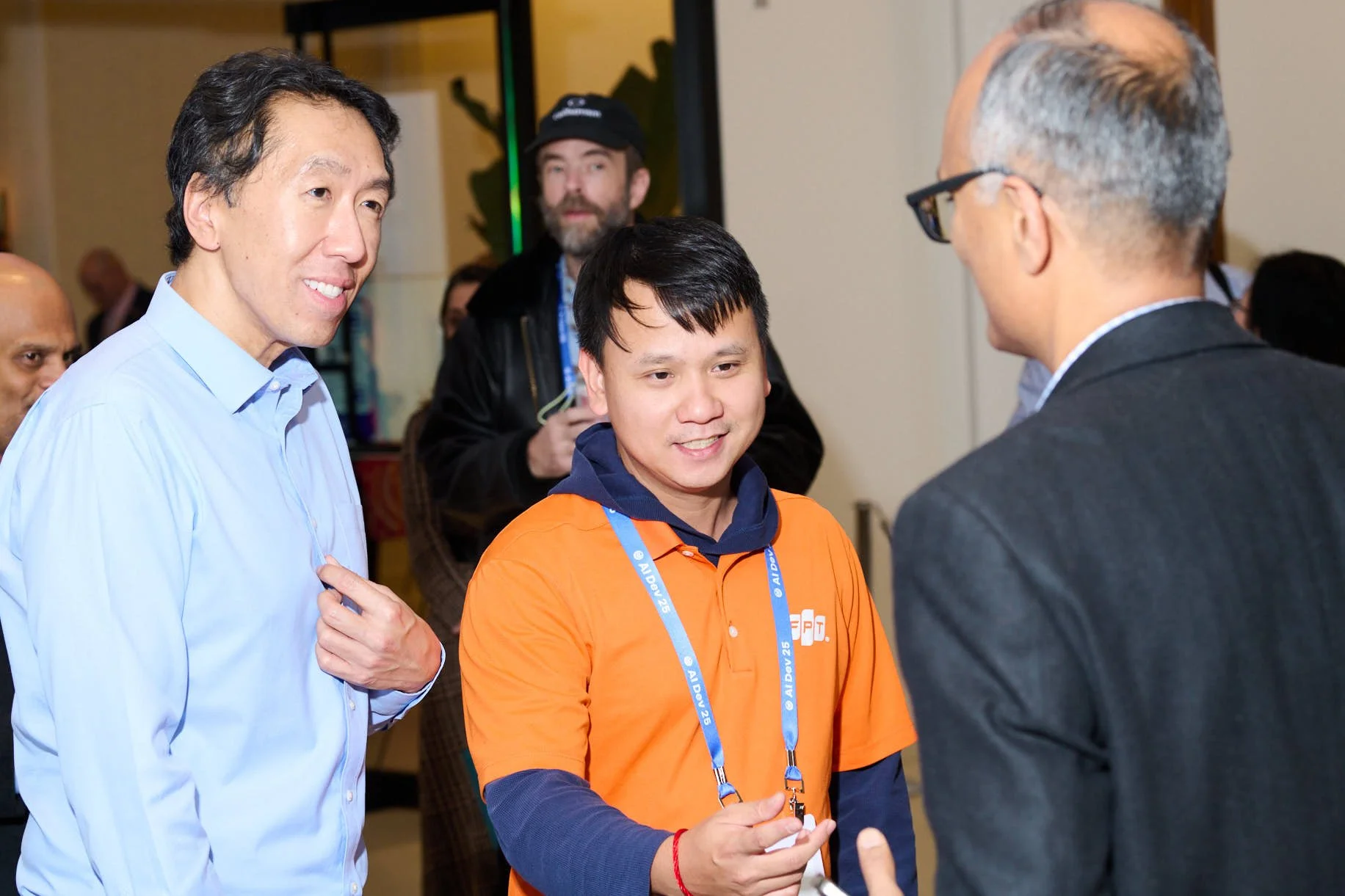 A fan at Deeplearning.AI Tech conference shaking hands with Andrew Ng