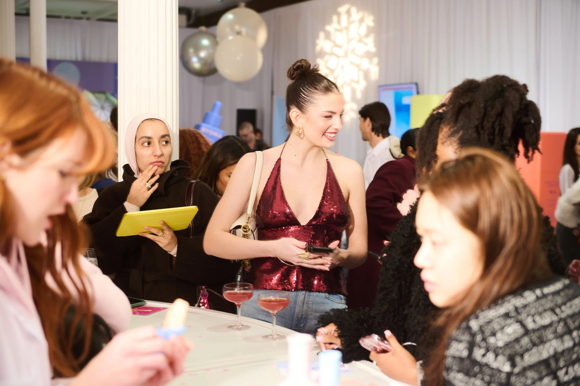 A woman enjoying herself at a pop-up for Byoma skincare, in Soho New York