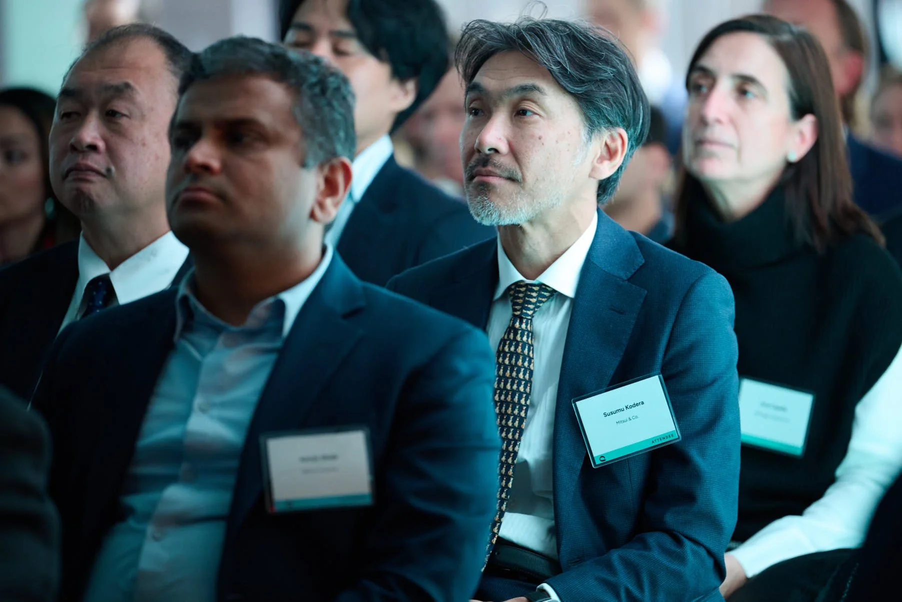 man in crowd at quantinuum nasdaq 