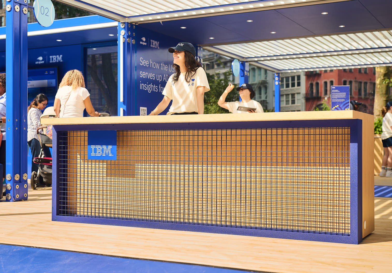 Brand Ambassador at IBM's spacecube installation greeting people as they come in