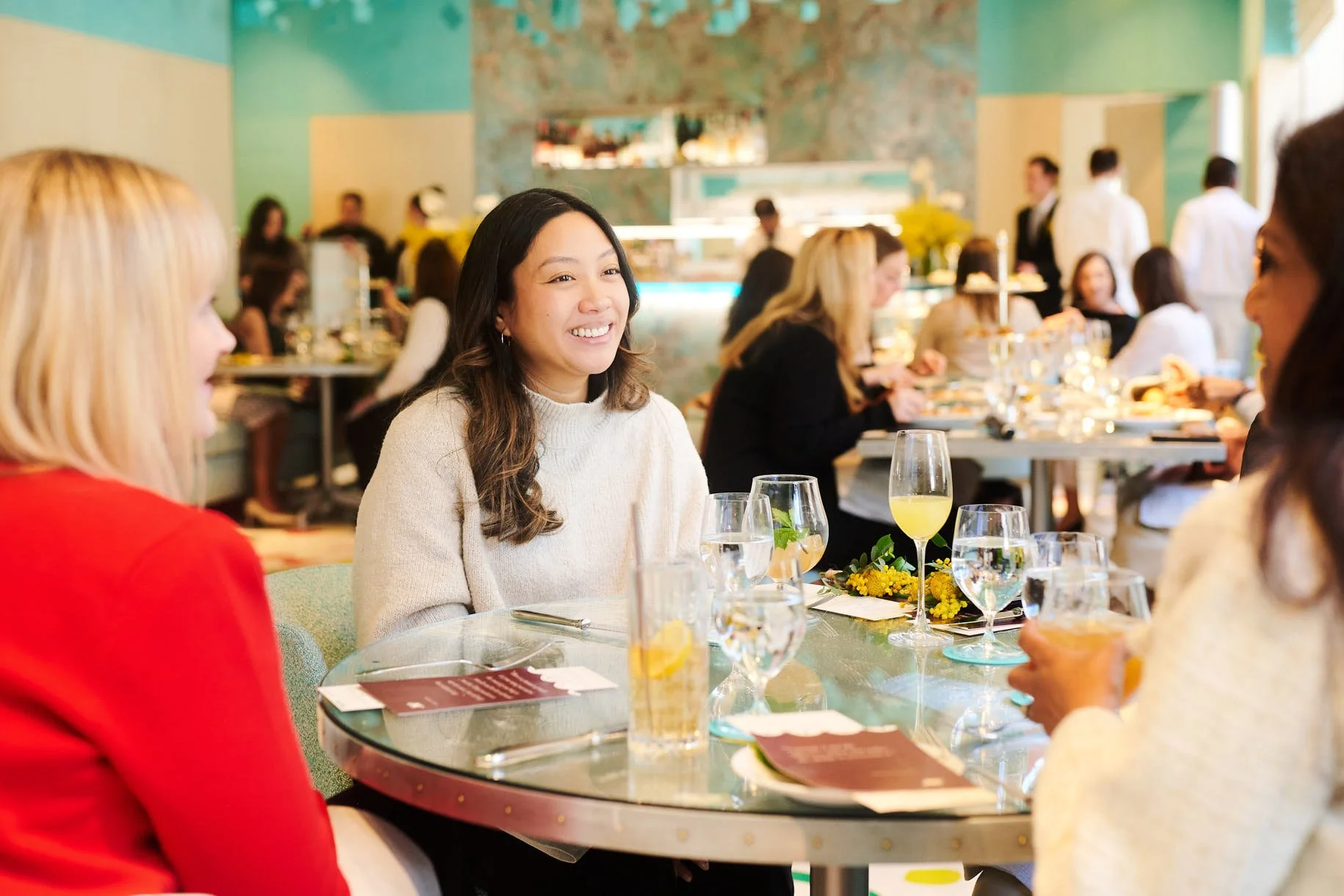 Event photograph of an attendee smiling at Tiffany's in its collaboration with The Venetian 