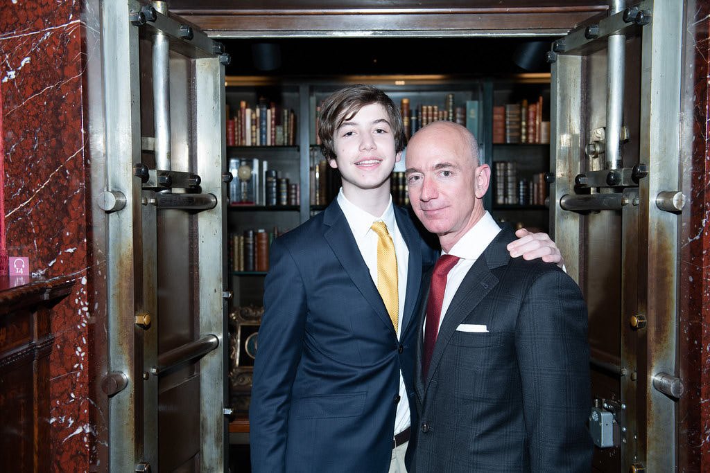 Professional Event Photograph of Jeff Bezos and his son, Preston, at the back of the JP Morgan Library, New York, New York