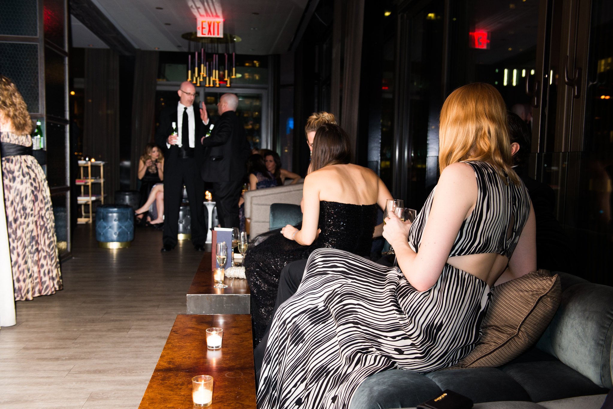Well lit photo of women at a birthday party 