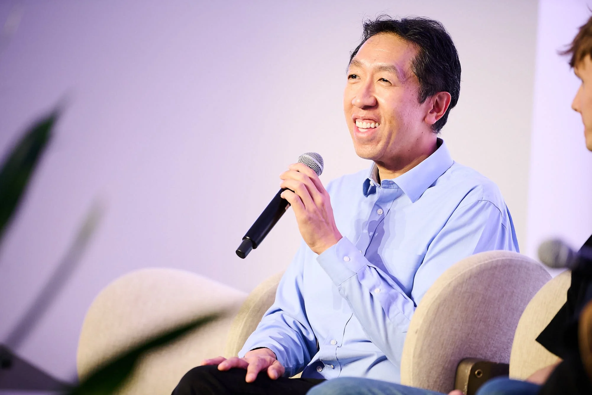 Event Photograph of Andrew Ng smiling while in a panel discussion after his Keynote at Tech Conference, New York, New York