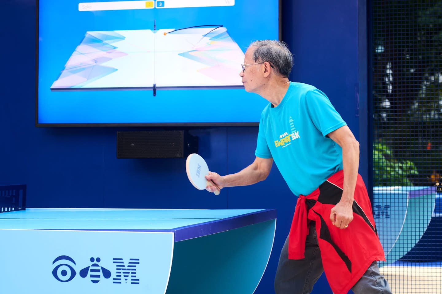 Professional Event Photograph of a man playing table tennis at an IBM activation in Madison Square Park, New York, New York