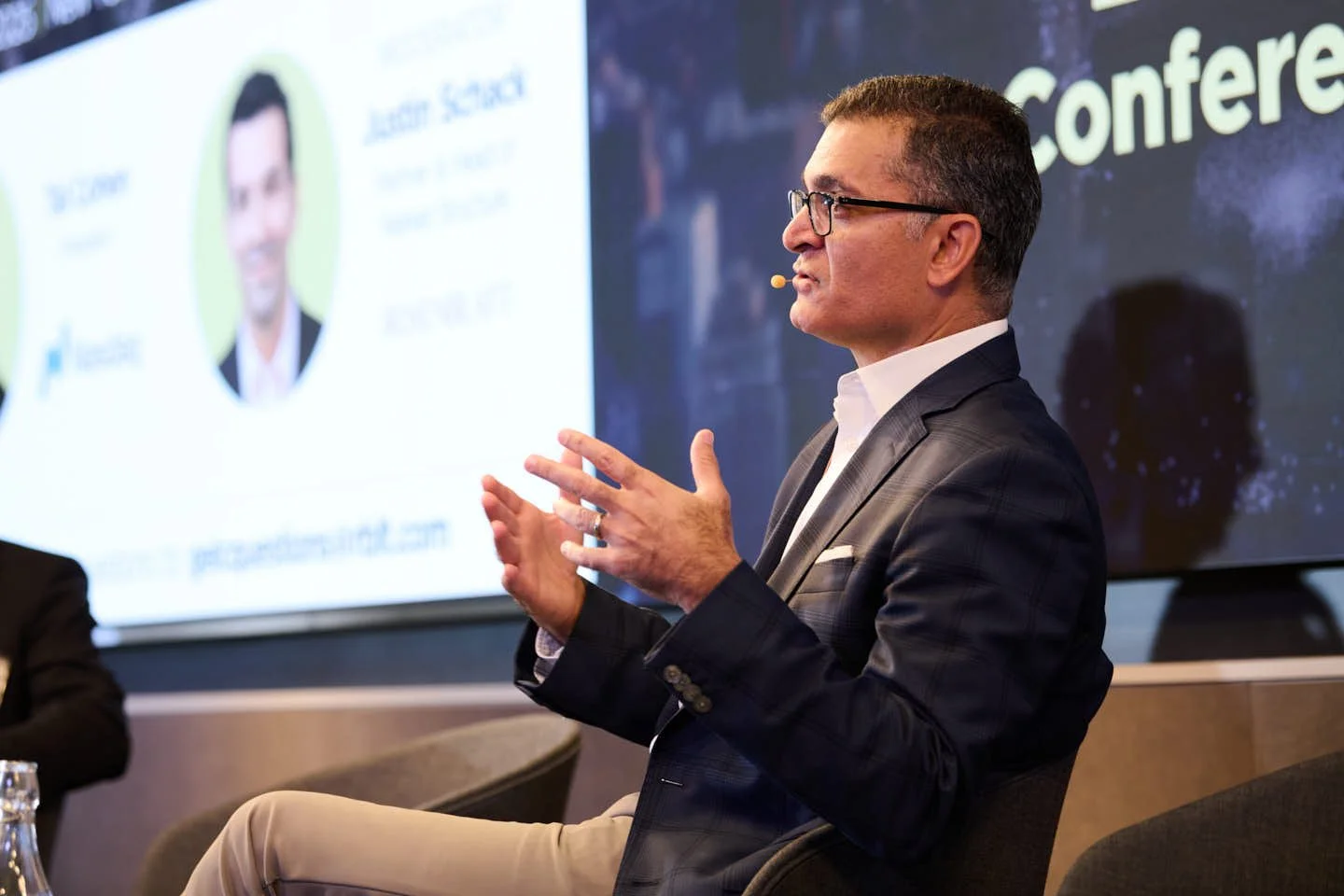 Tal Cohen onstage speaking at the global exchange leader conference for Rosenblatt Securities 