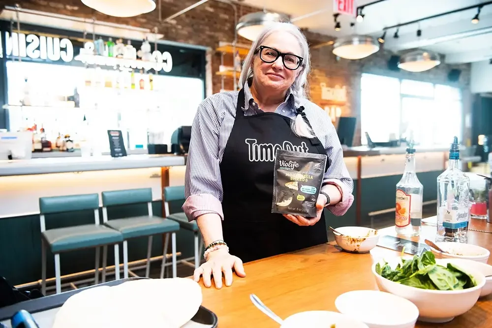 Female chef at Timeout Market NYC