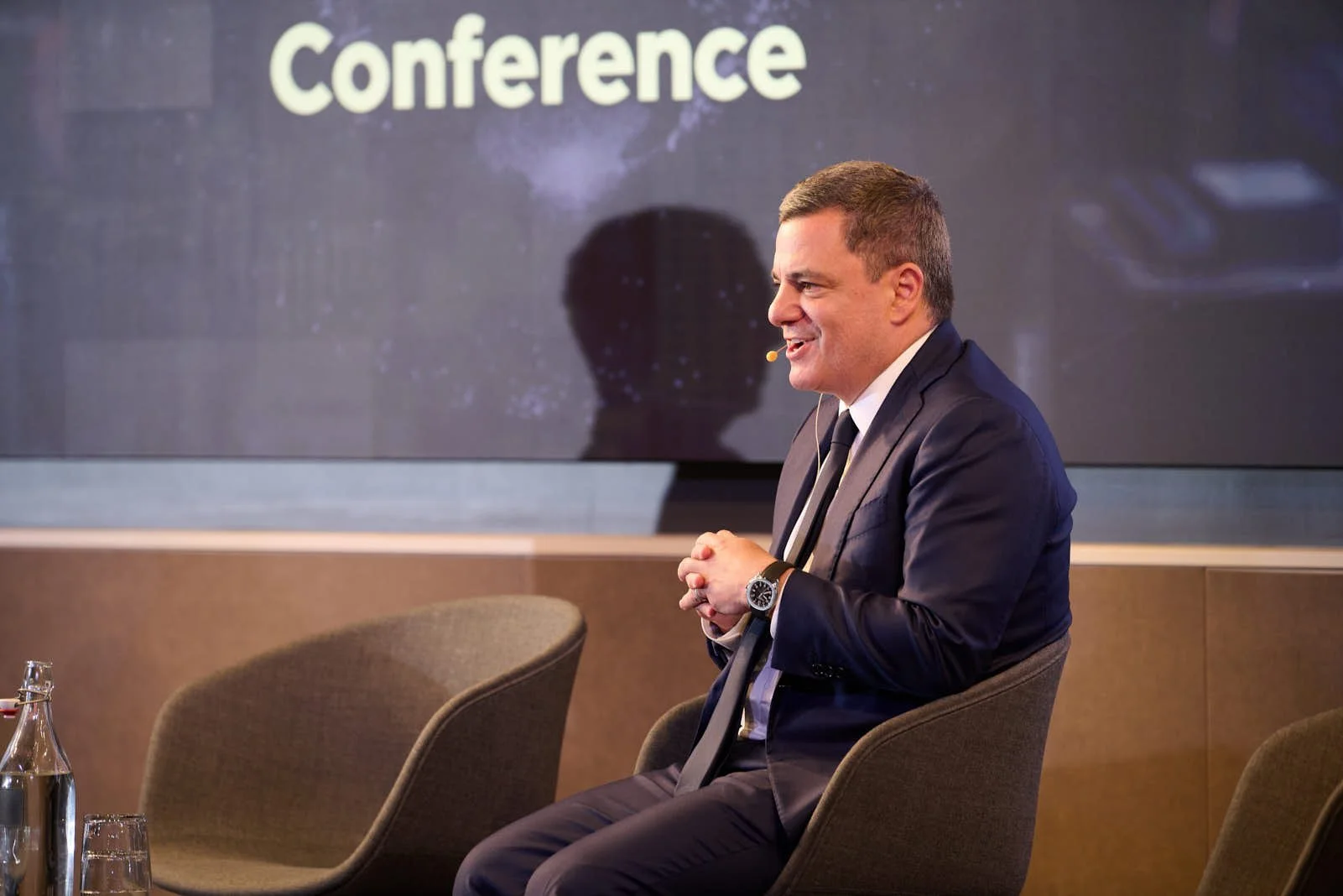 Jim Esposito of Citadel onstage smiling at the global exchange leader conference for Rosenblatt Securities 