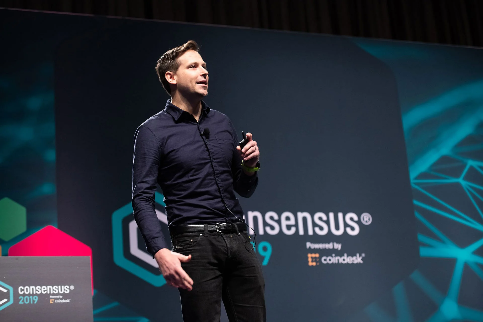 Man on stage at Consensus 2019