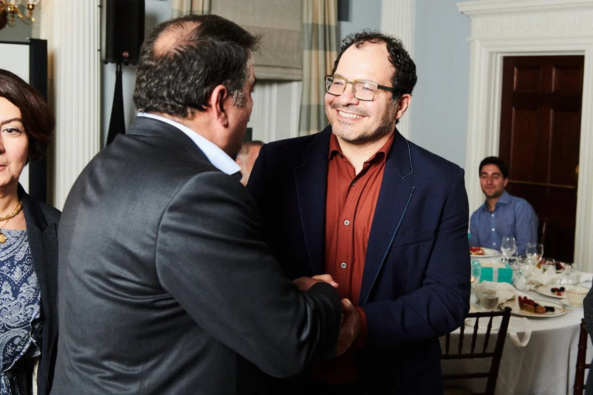 Ali Partovi smiling at a private fundraising dinner in New York 